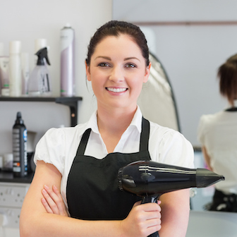 A hairdresser with a blowdryer