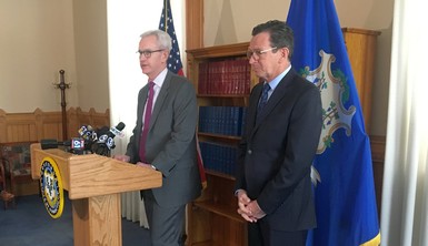 Supreme Court Justice Andrew J. McDonald speaking at podium