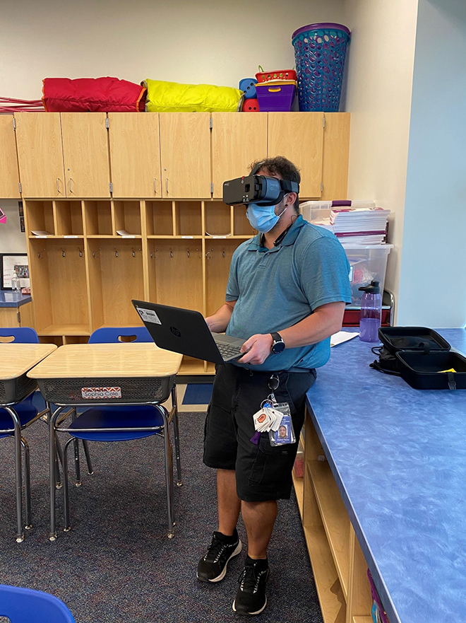 Photo of man wearing a visual accessibility devie