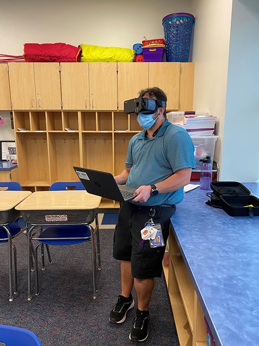 Photo of man wearing a visual accessibility devie