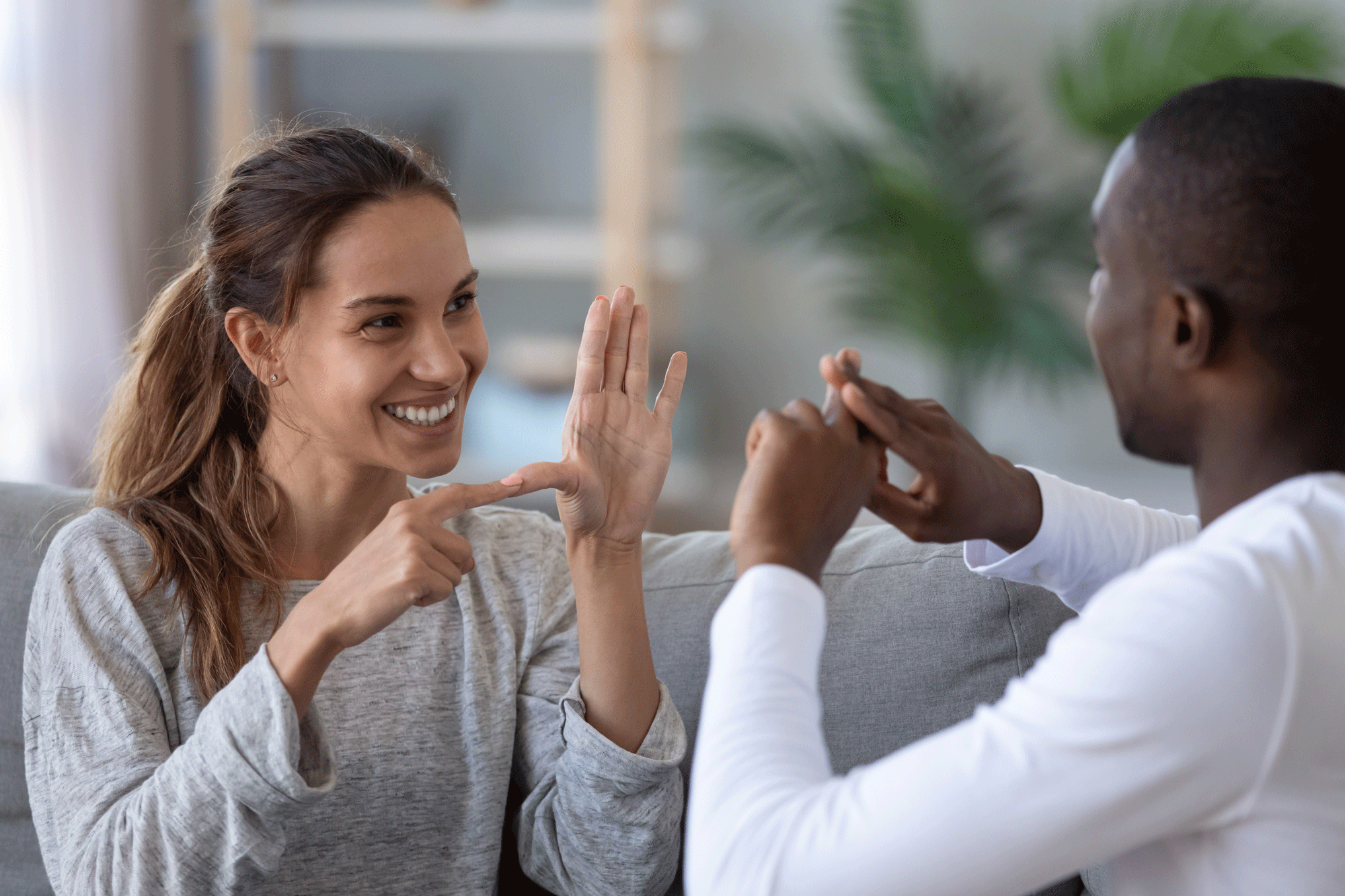 picture of man and women signing to each other