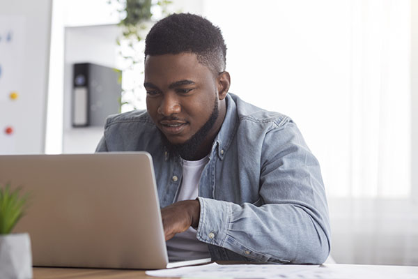 Man looking into a laptop