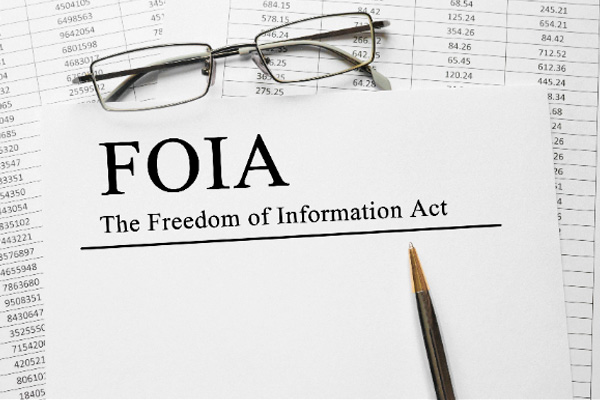 Pencil on notepad with caption ‘FOIA The Freedom of Information Act’.
