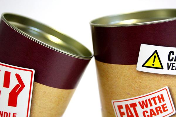 Two food cans with red lettering