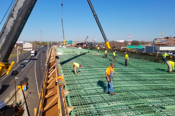 Workers constructing a bridge