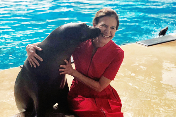 Lt. Governor Bysiewicz being kissed by a seal.
