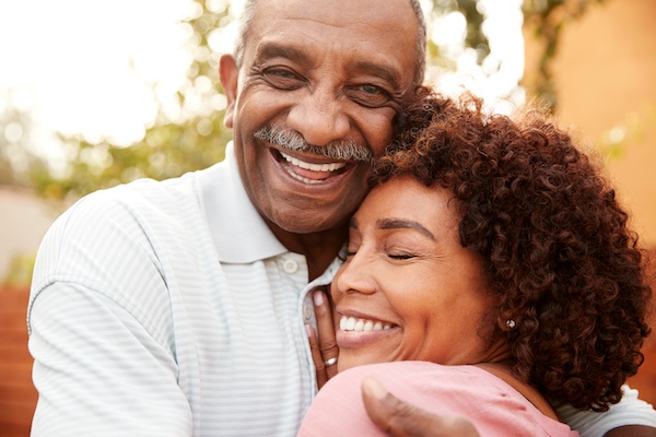 man and woman hugging