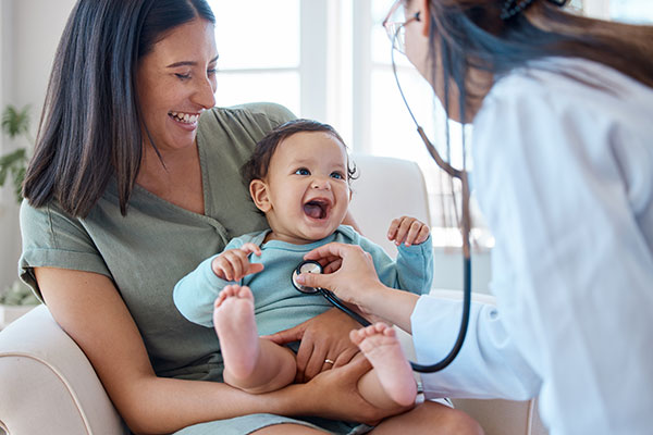 nurse visits mom and baby