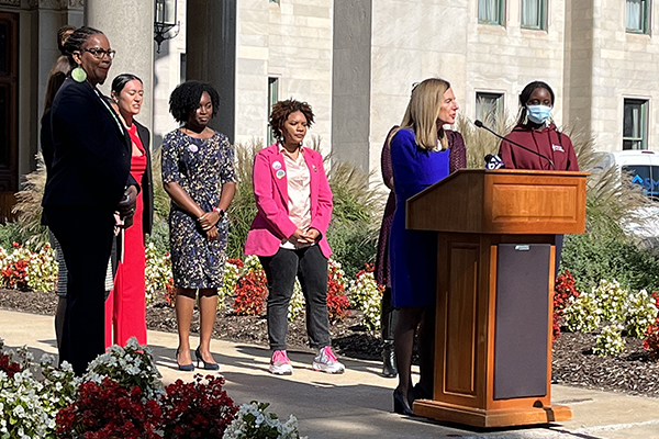 Lieutenant Governor Susan Bysiewicz giving a speech in front of the State Capitol.
