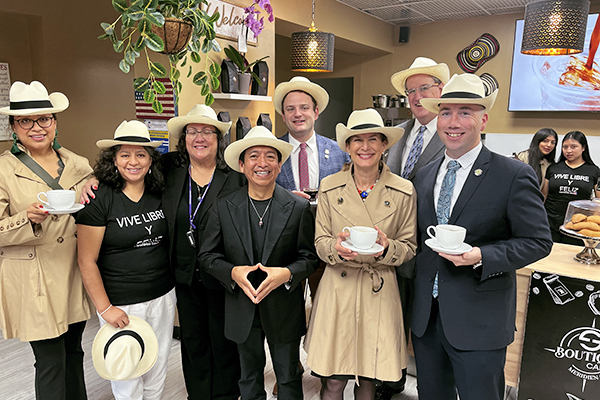Lieutenant Governor Bysiewicz with a group of constituents wearing custom hats at a local restaurant.