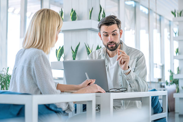 two people discussing business