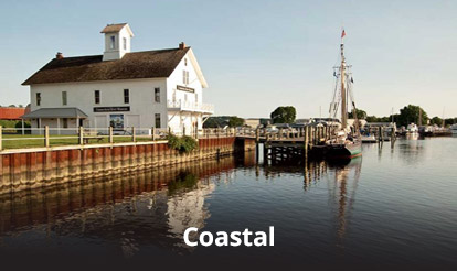 home on the coast with boat